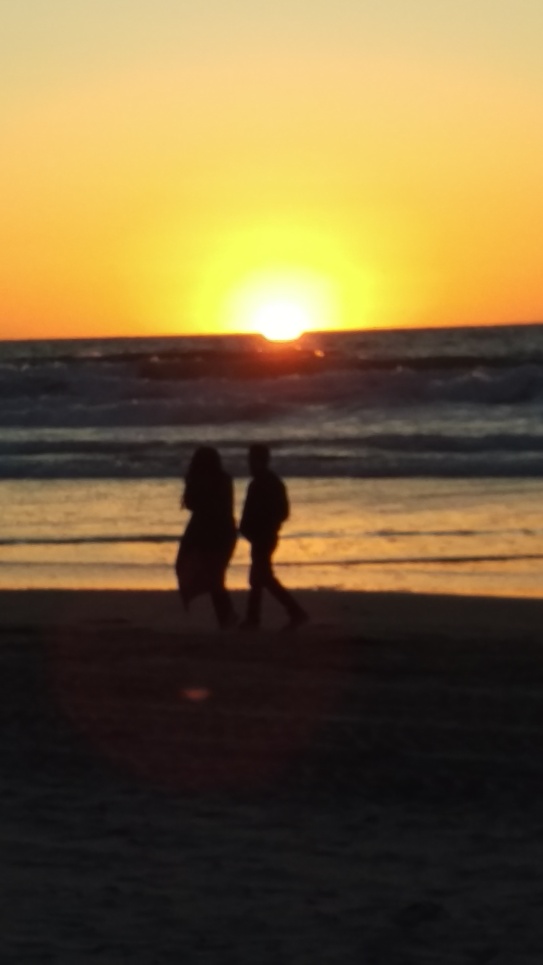 two walking at sunset